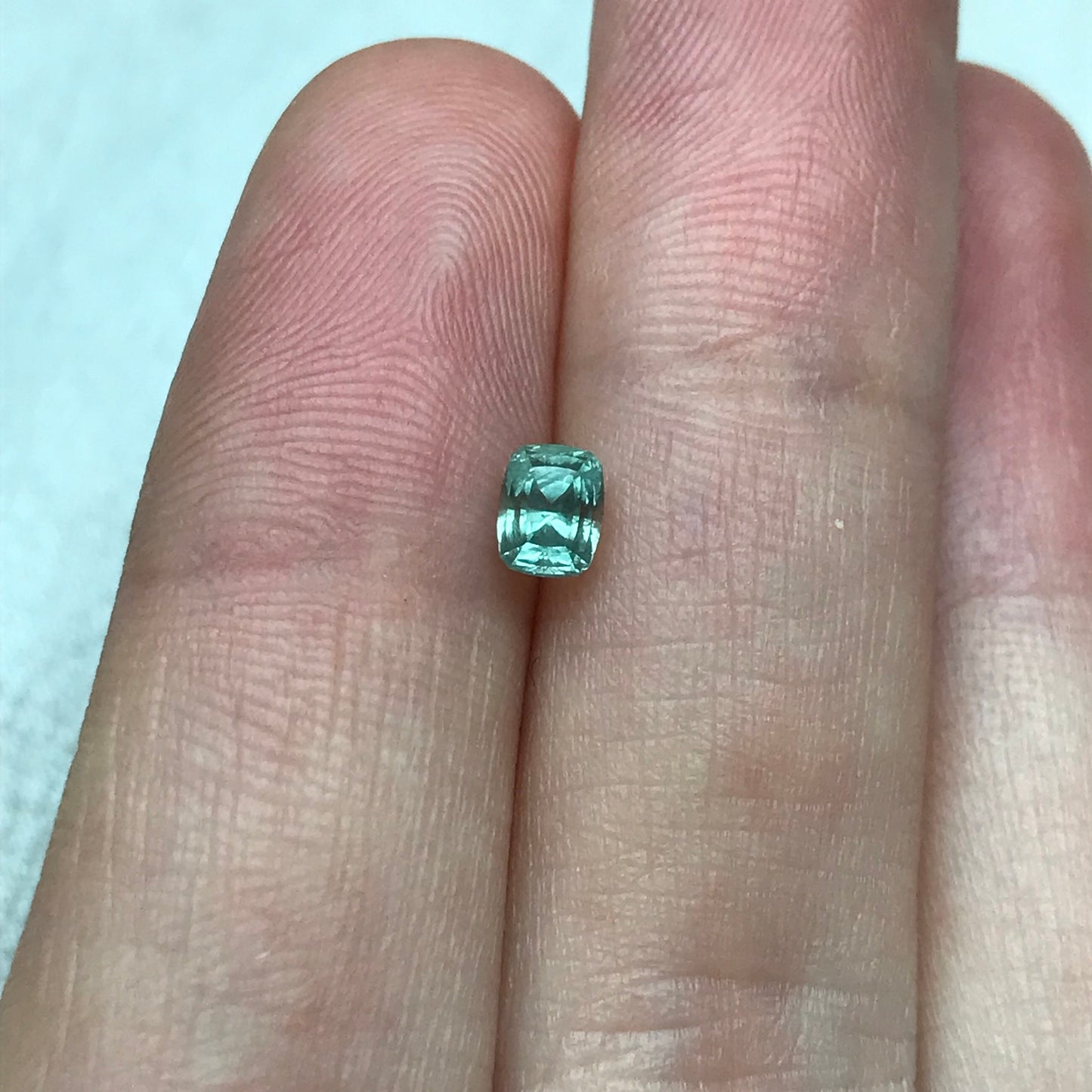 Bluish Green Montana Sapphire 0.69 carat, 4.7x3.7 mm Rectangular Cushion Cut, Unheated Faceted Loose Gemstone