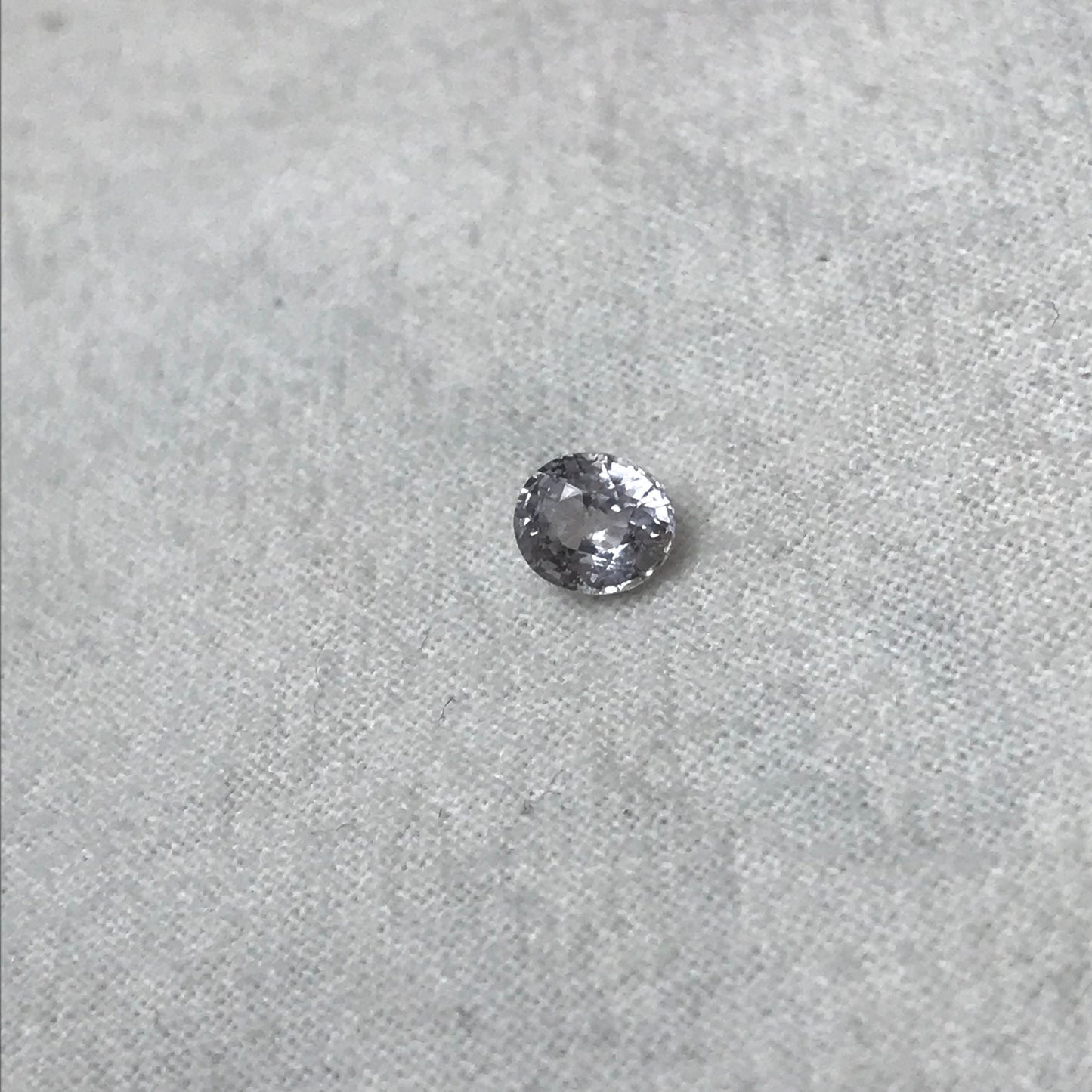 Faint Purple Natural Sapphire 0.85 carat 5.7x5mm Oval Cut, Faceted Loose Unheated Lightly Colored Silver Sapphire