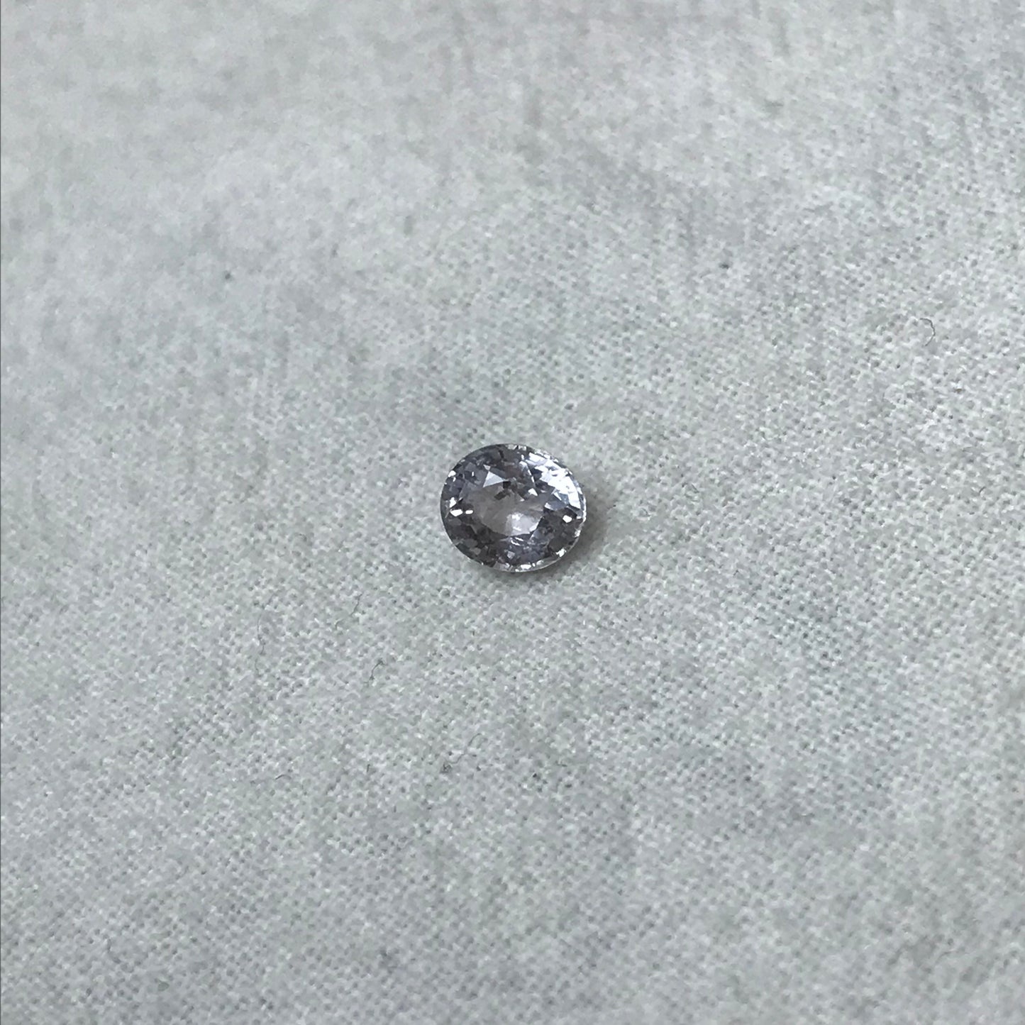 Faint Purple Natural Sapphire 0.85 carat 5.7x5mm Oval Cut, Faceted Loose Unheated Lightly Colored Silver Sapphire