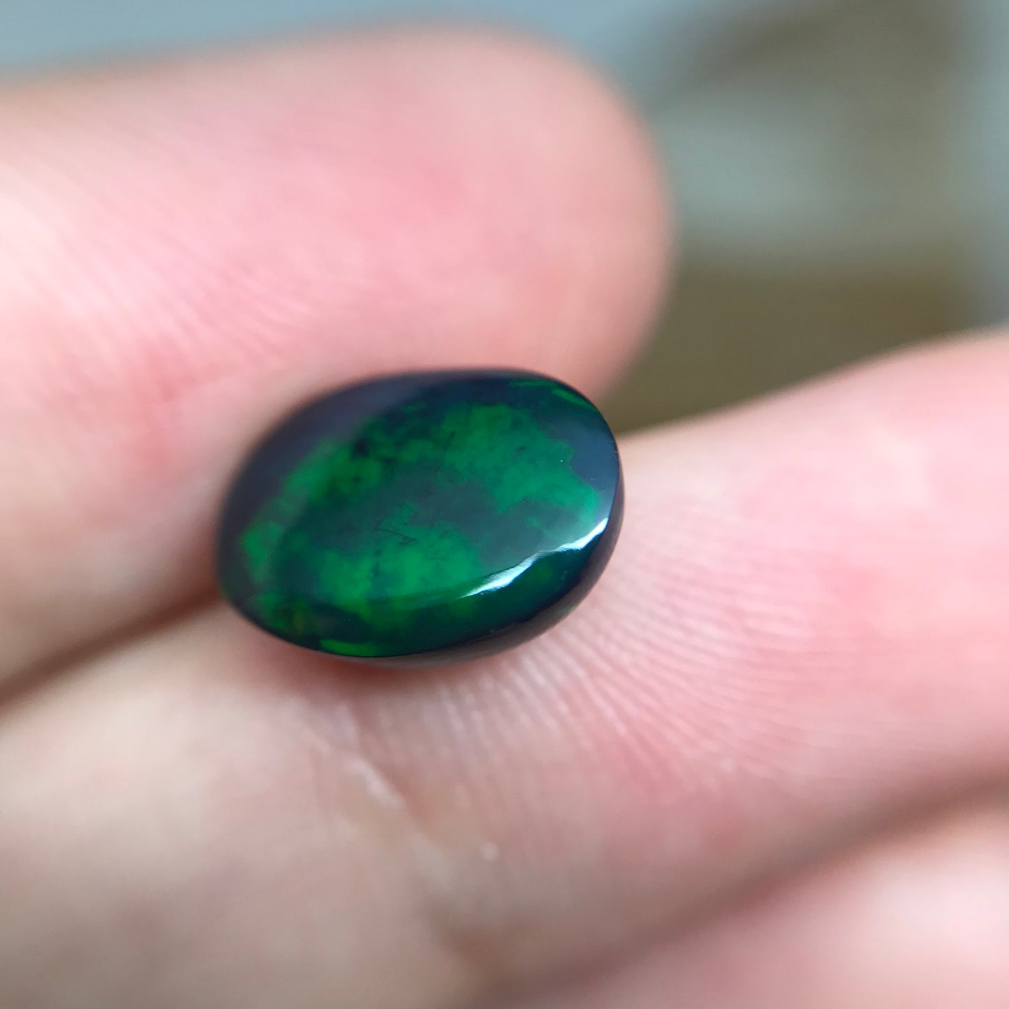 Black Opal 2.33 carat 11.8x8.7mm Oval Cabochon, Heat/Sugar  Enhanced Natural Opal