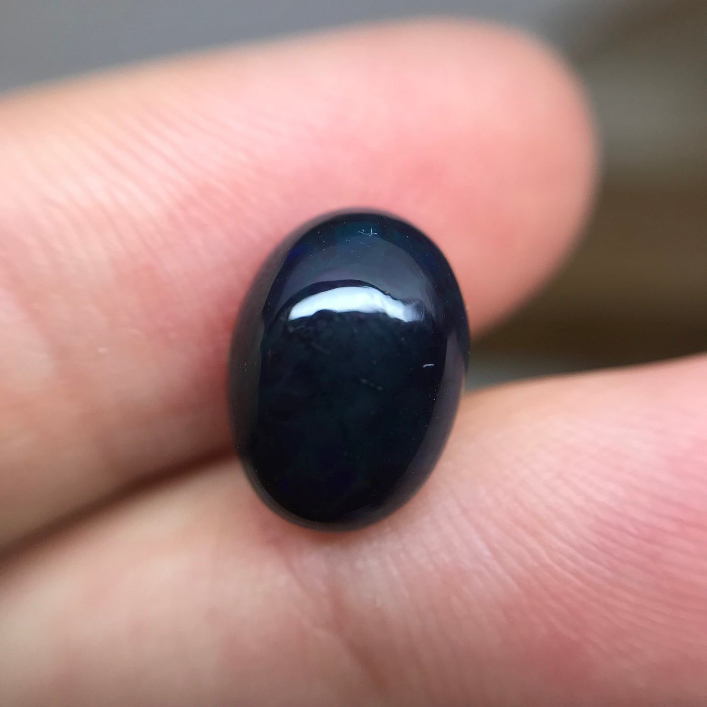 Black Opal 2.33 carat 11.8x8.7mm Oval Cabochon, Heat/Sugar  Enhanced Natural Opal