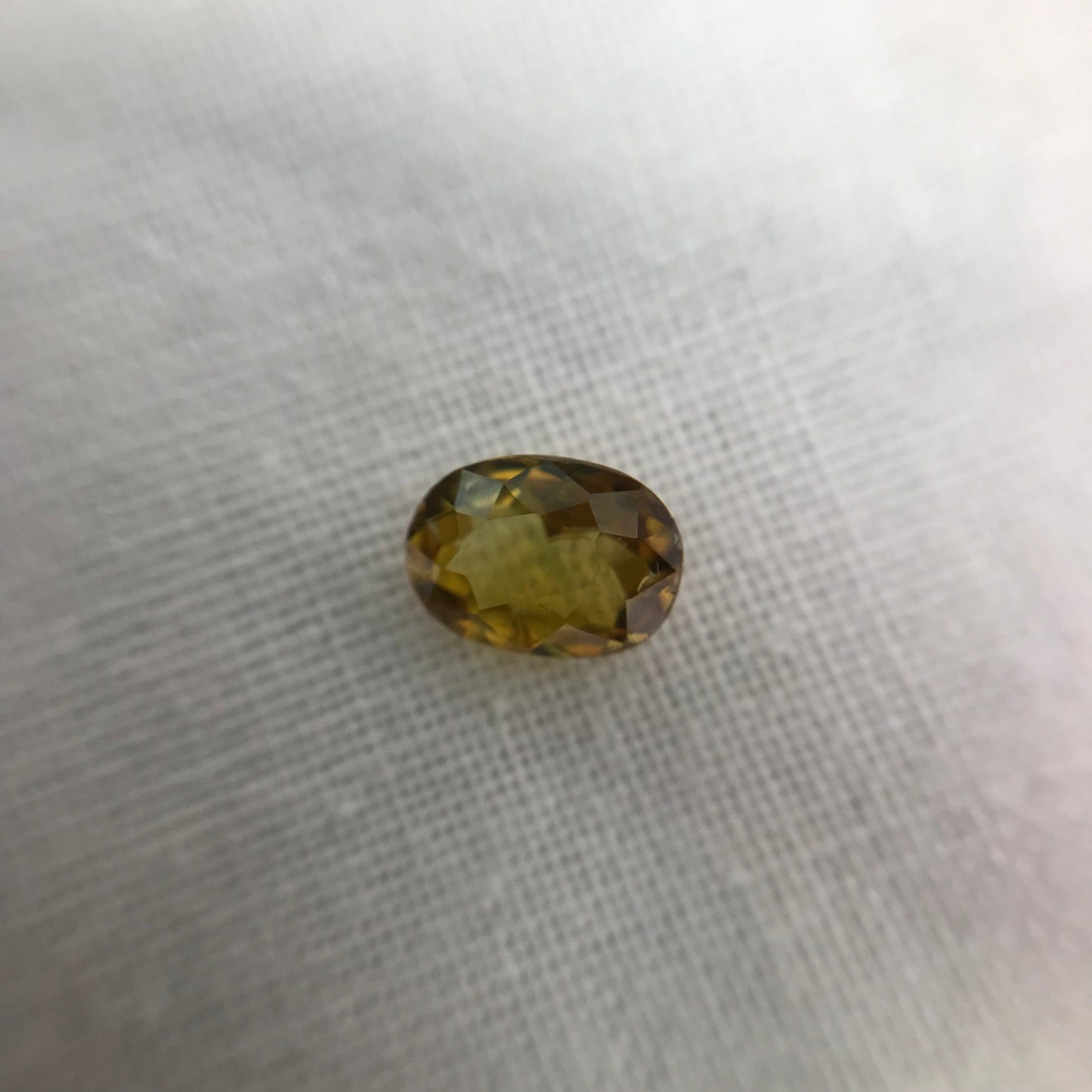 7x5mm Yellow Sphene Oval Cut, 0.84 Carat Natural Orangish Yellow Sphene with Rainbow Flashes