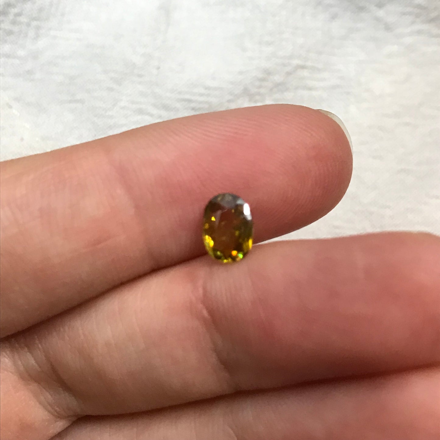 7x5mm Yellow Sphene Oval Cut, 0.84 Carat Natural Orangish Yellow Sphene with Rainbow Flashes