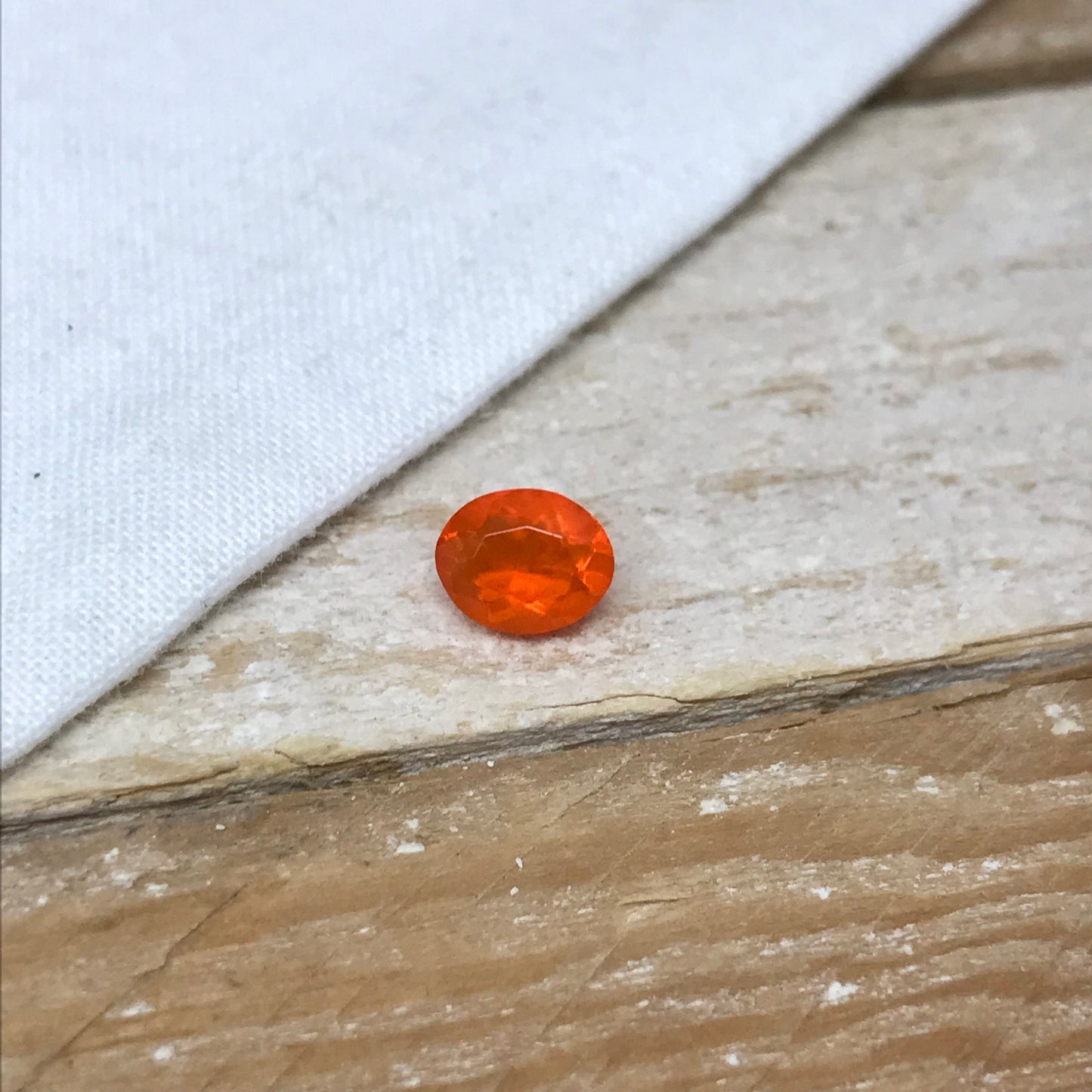 0.69 Carat Orange Mexican Fire Opal 7.4x6.0mm Oval Cut, Faceted Loose Opal
