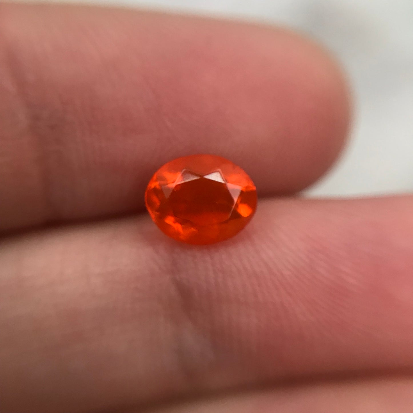 0.69 Carat Orange Mexican Fire Opal 7.4x6.0mm Oval Cut, Faceted Loose Opal