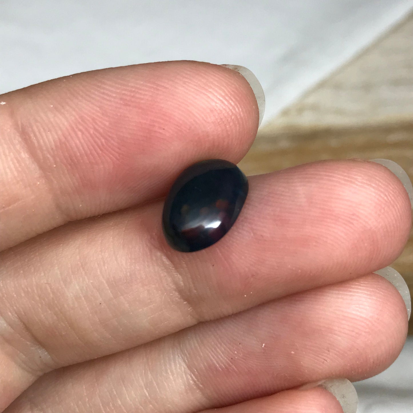 Black Opal 2.33 carat 11.8x8.7mm Oval Cabochon, Heat/Sugar  Enhanced Natural Opal