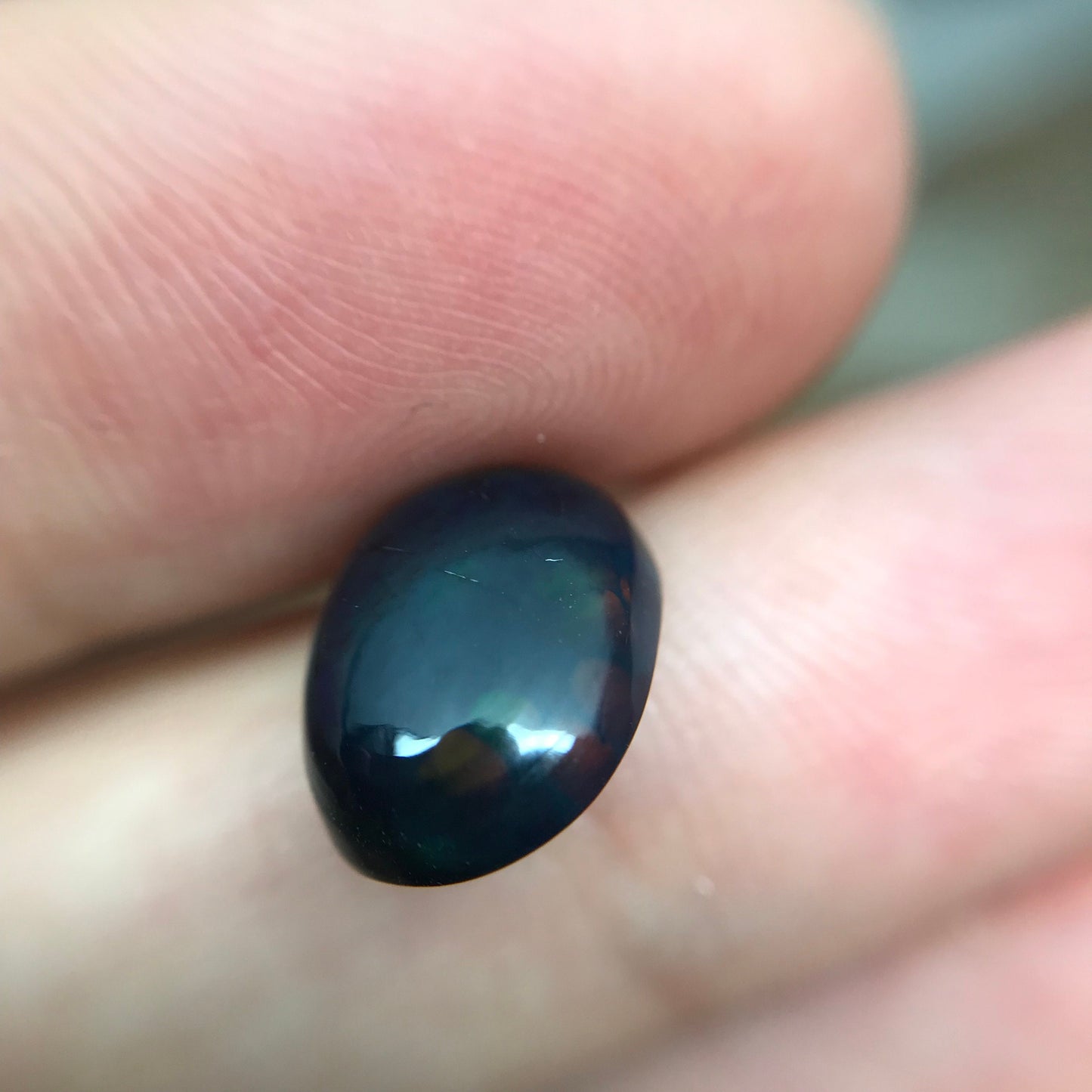 Black Opal 2.33 carat 11.8x8.7mm Oval Cabochon, Heat/Sugar  Enhanced Natural Opal