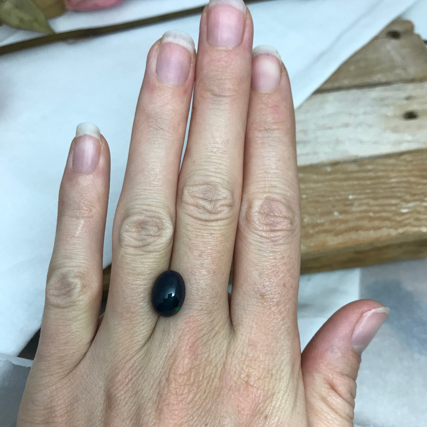 Black Opal 2.33 carat 11.8x8.7mm Oval Cabochon, Heat/Sugar  Enhanced Natural Opal