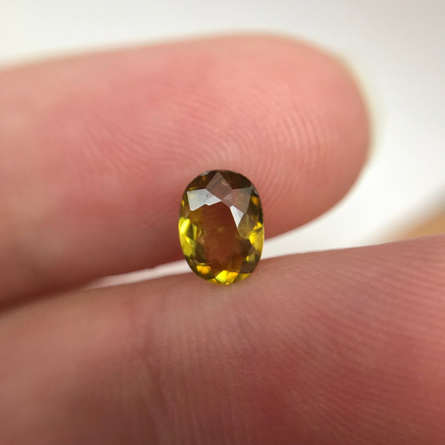7x5mm Yellow Sphene Oval Cut, 0.84 Carat Natural Orangish Yellow Sphene with Rainbow Flashes