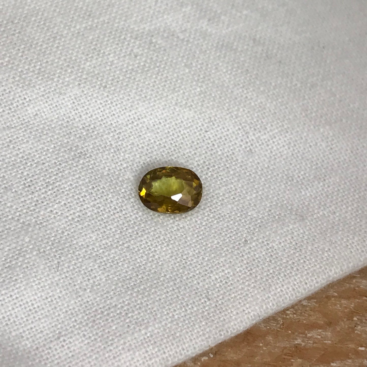 7x5mm Yellow Sphene Oval Cut, 0.84 Carat Natural Orangish Yellow Sphene with Rainbow Flashes