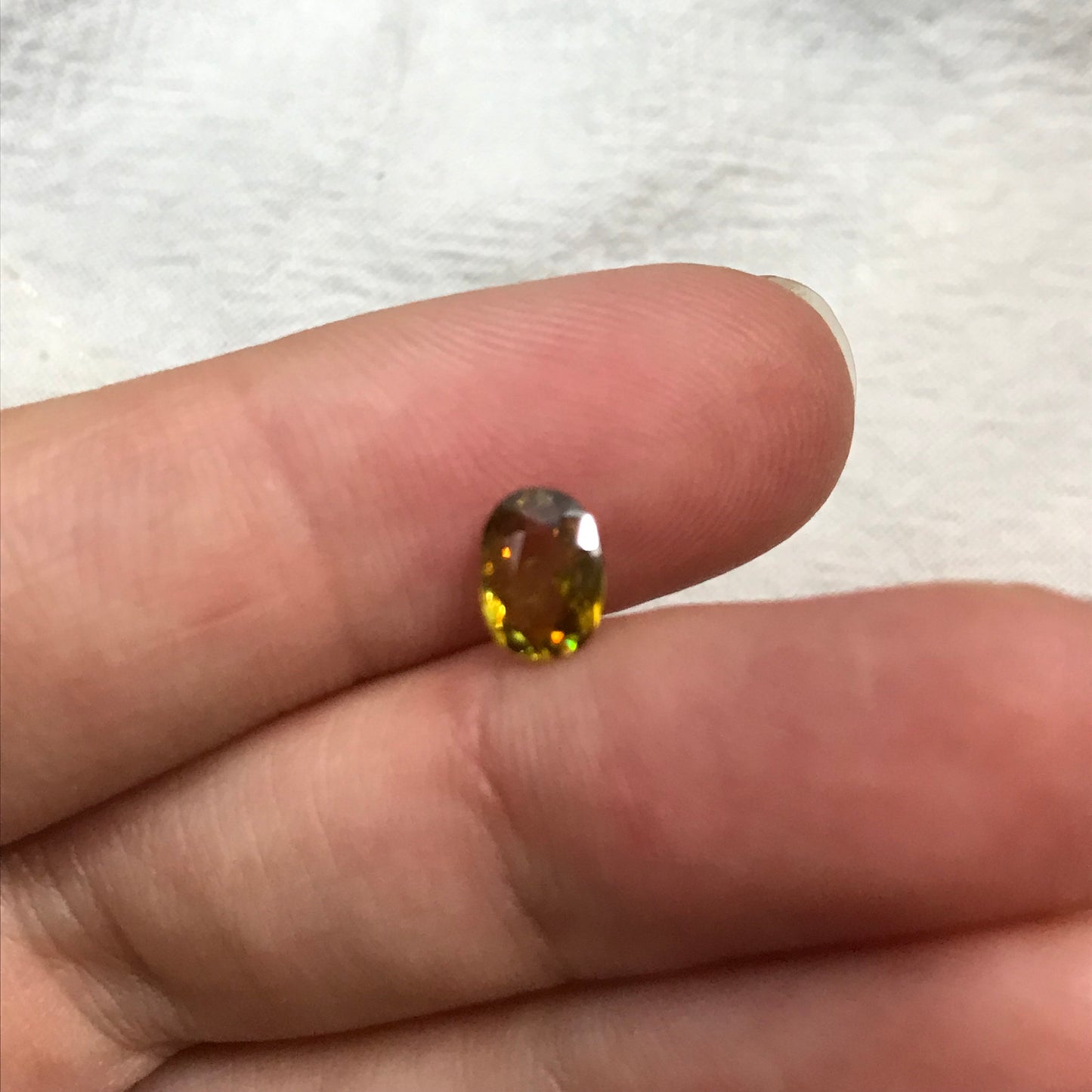 7x5mm Yellow Sphene Oval Cut, 0.84 Carat Natural Orangish Yellow Sphene with Rainbow Flashes