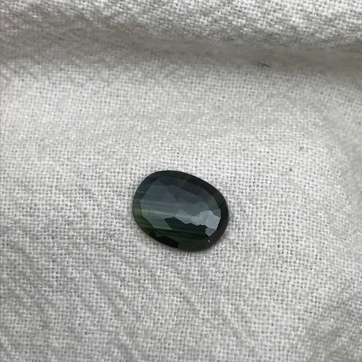 Blue Sapphire with Green Color Zoning 9.5x7.3mm Oval Cut, 1.69 Carat Faceted Loose Natural Shallow cut Sapphire