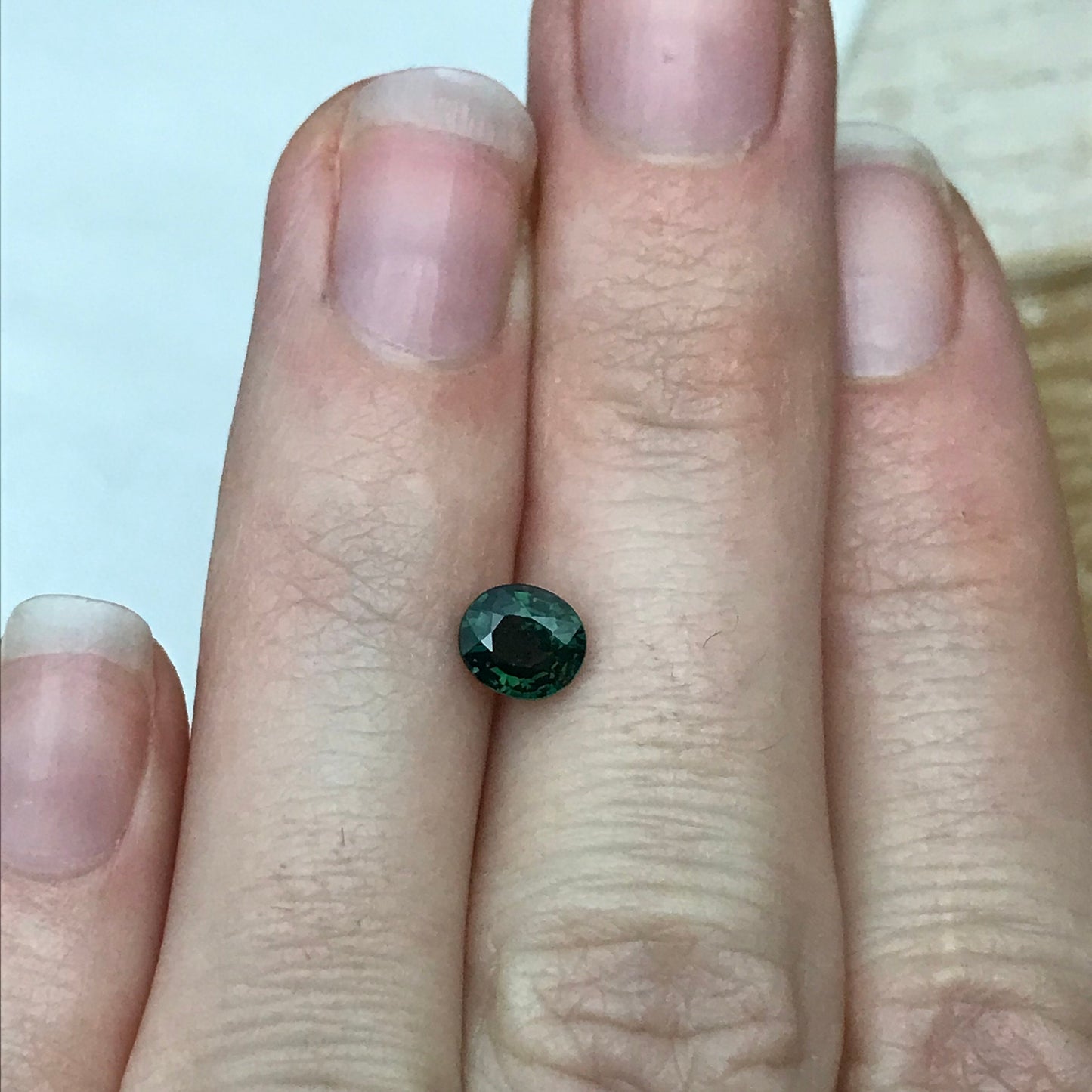 0.87 carat Natural Green Sapphire 5.8x5.1 Oval, Approx. 6x5mm