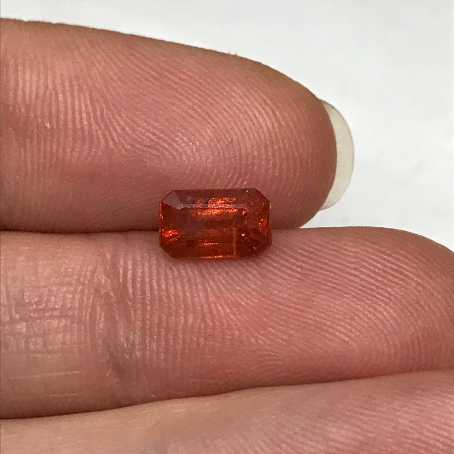 1.57 ct Natural Orange Sapphire 7.7x4.7mm Emerald Cut Loose Faceted Gem, Reddish Orange Beryllium Treated Sapphire