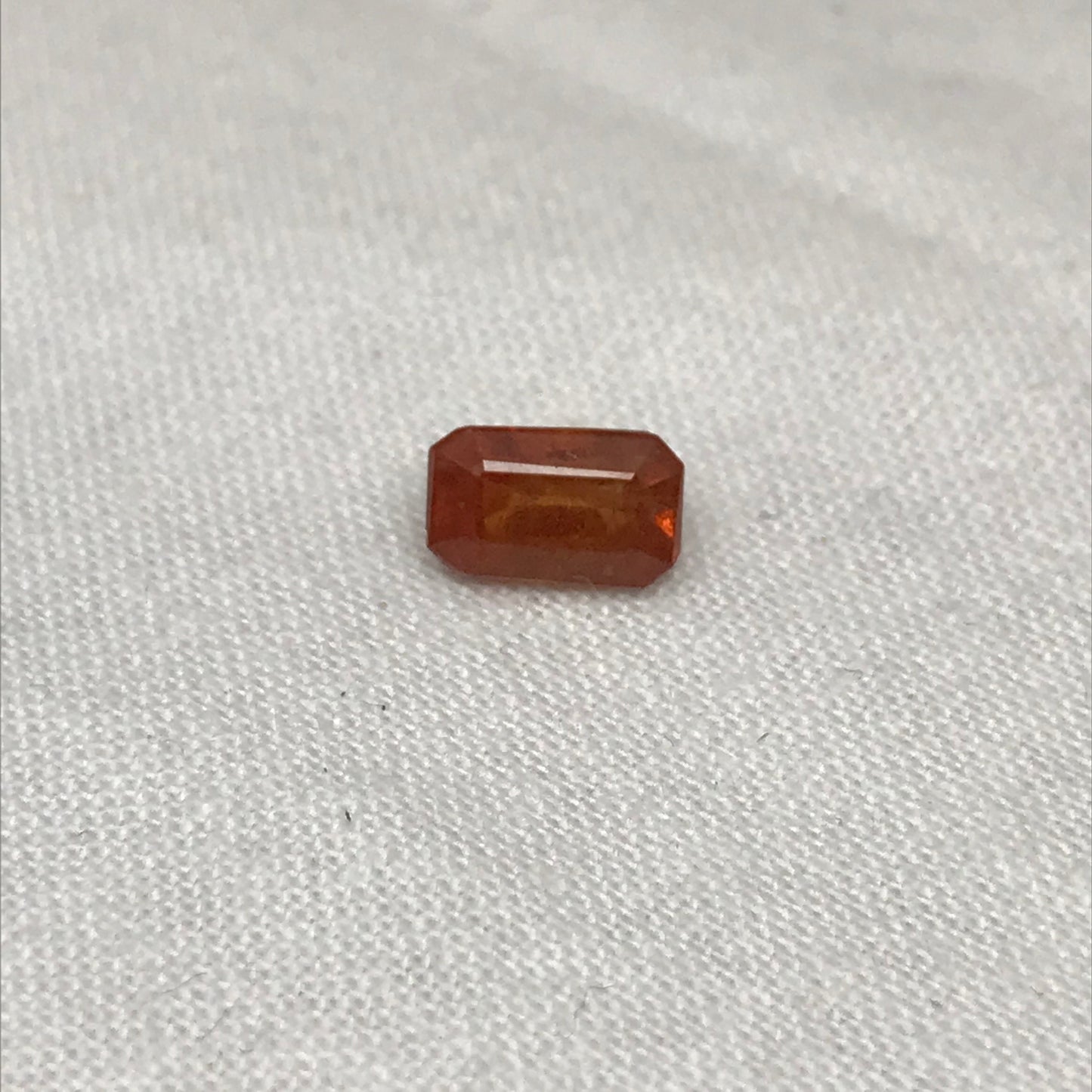 1.57 ct Natural Orange Sapphire 7.7x4.7mm Emerald Cut Loose Faceted Gem, Reddish Orange Beryllium Treated Sapphire