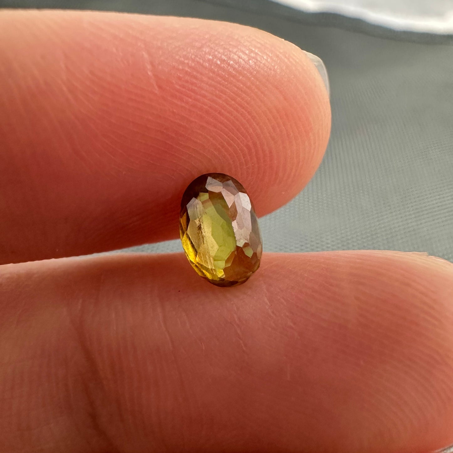 7x5mm Yellow Sphene Oval Cut, 0.92 Carat Natural Orangish Yellow Sphene with Rainbow Flashes