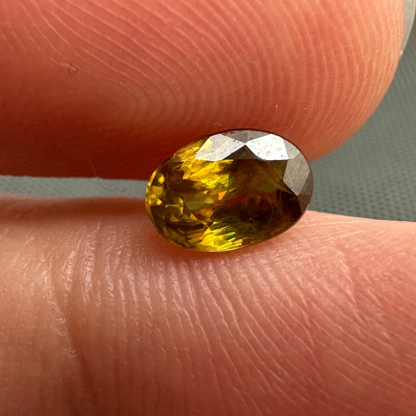 7x5mm Yellow Sphene Oval Cut, 0.92 Carat Natural Orangish Yellow Sphene with Rainbow Flashes