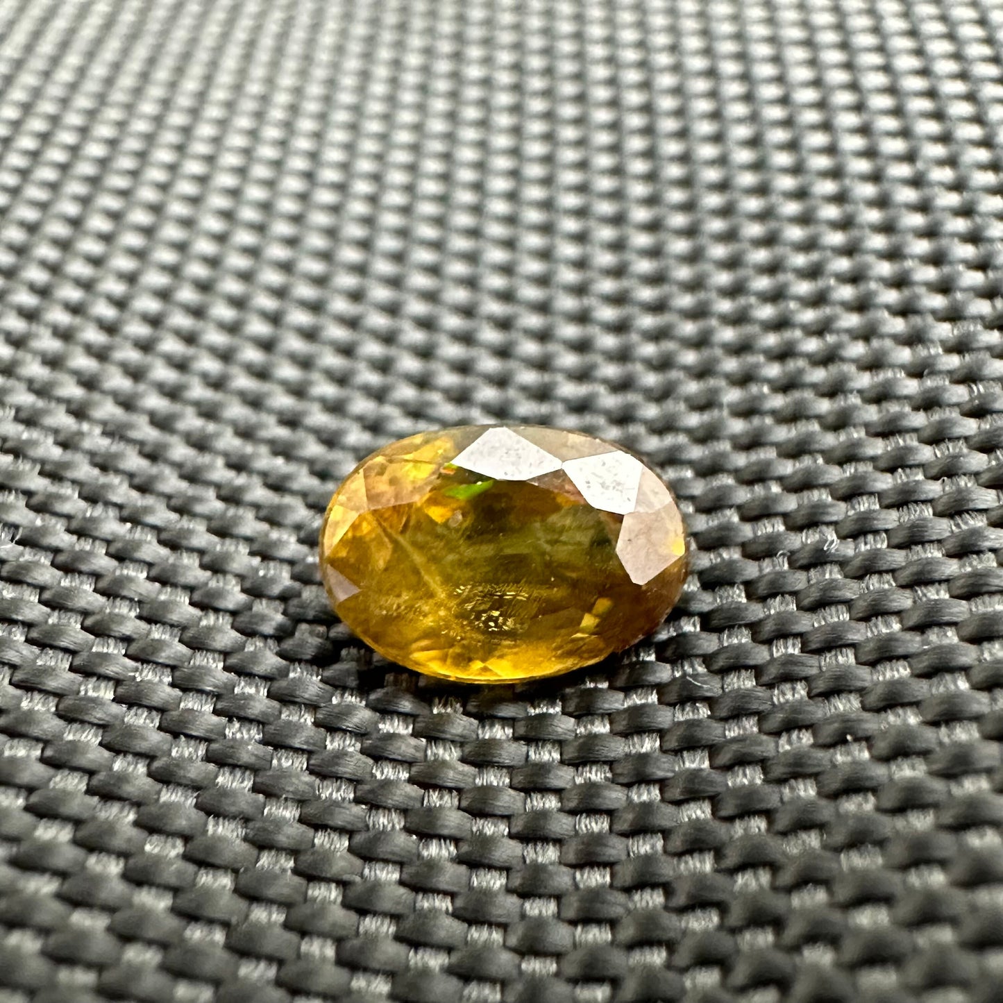 7x5mm Yellow Sphene Oval Cut, 0.92 Carat Natural Orangish Yellow Sphene with Rainbow Flashes