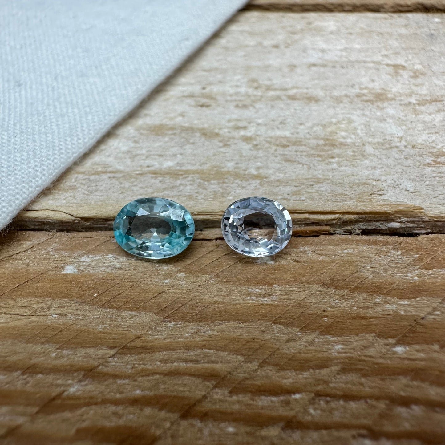 Natural Light Sapphire and Blue Zircon Parcel, 6.8x5mm Oval cut Zircon and 5.8x5mm Sapphire