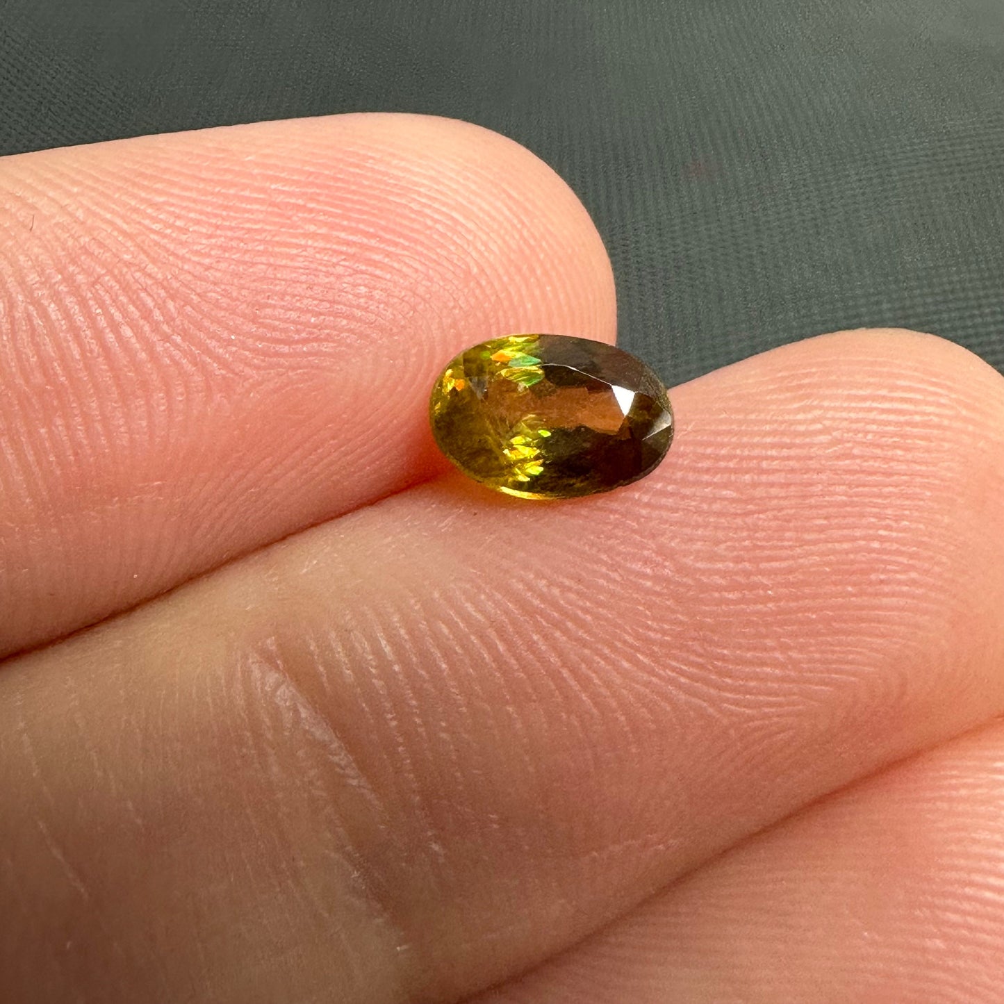 7x5mm Yellow Sphene Oval Cut, 0.92 Carat Natural Orangish Yellow Sphene with Rainbow Flashes