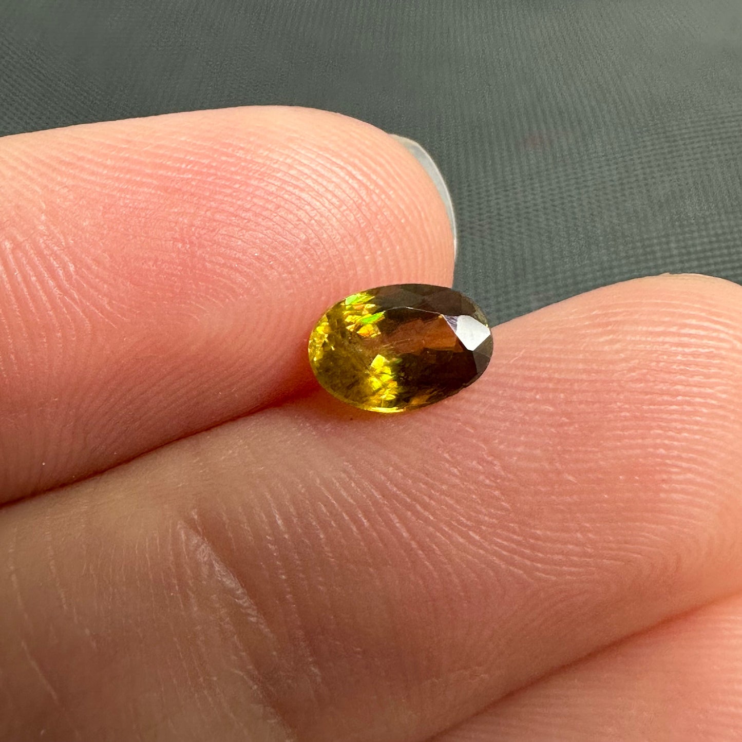 7x5mm Yellow Sphene Oval Cut, 0.92 Carat Natural Orangish Yellow Sphene with Rainbow Flashes