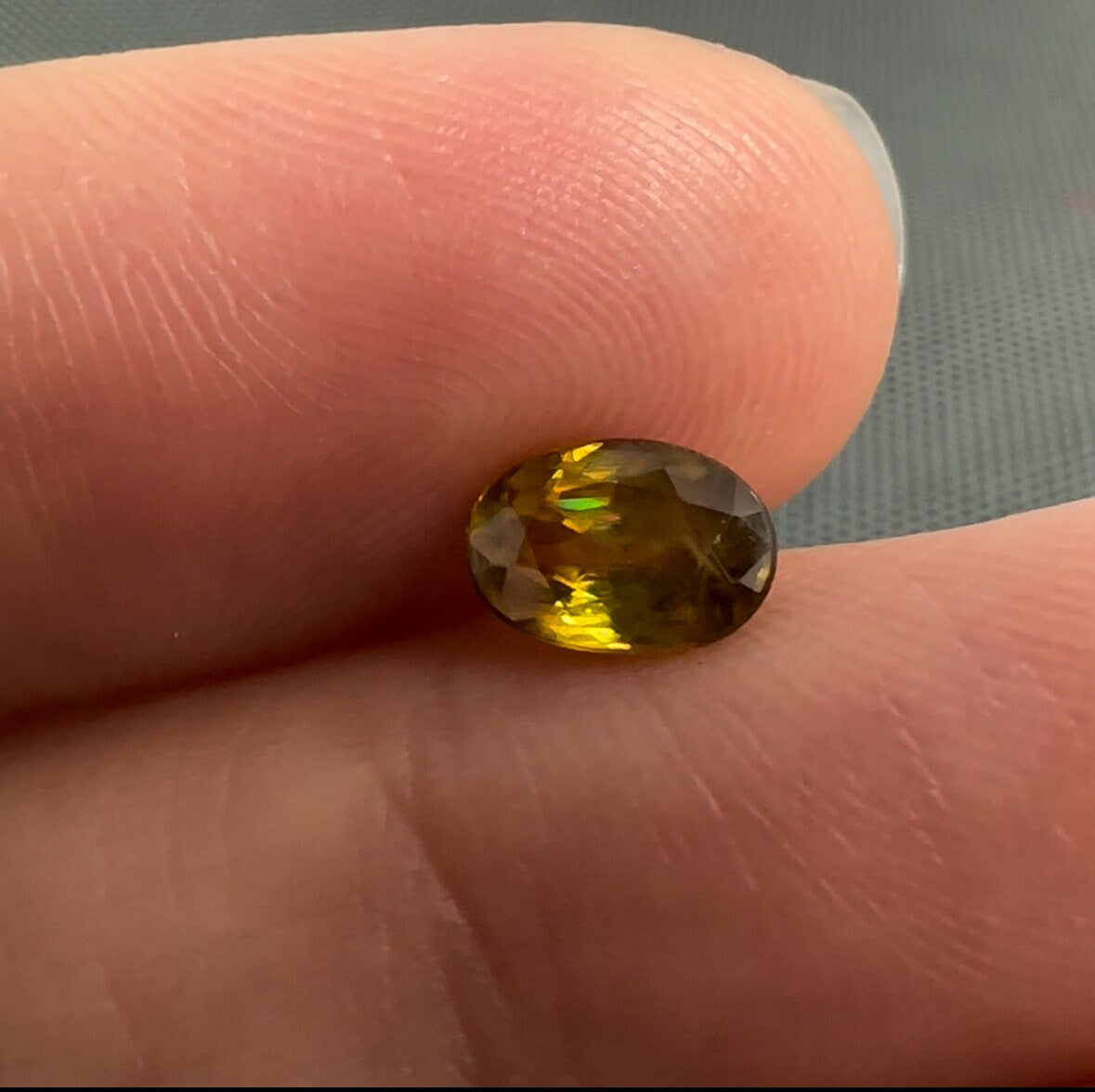7x5mm Yellow Sphene Oval Cut, 0.92 Carat Natural Orangish Yellow Sphene with Rainbow Flashes