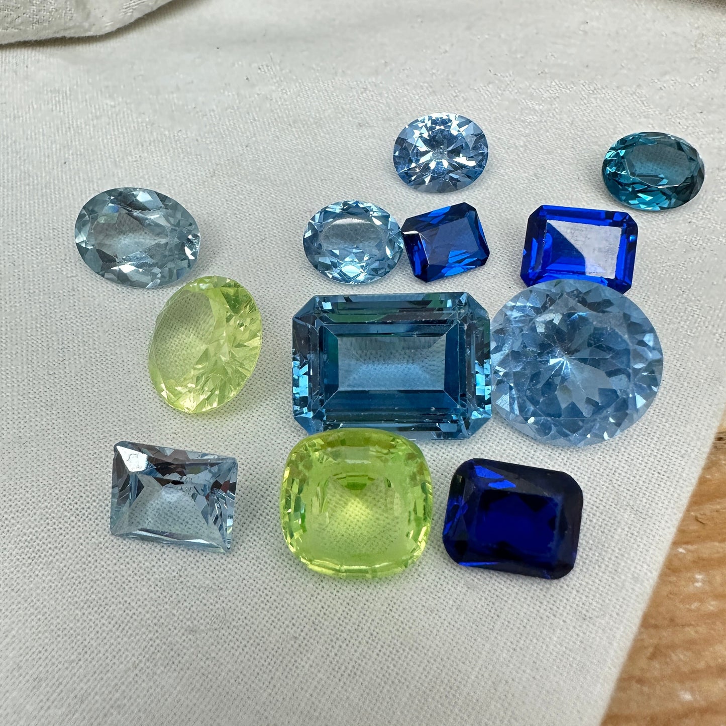 116 carat Lot of Lab Created Spinel 12 stones, Discounted Worn, Faceted, Recycled, Chipped, Damaged Gemstones, Blue and Yellow Green