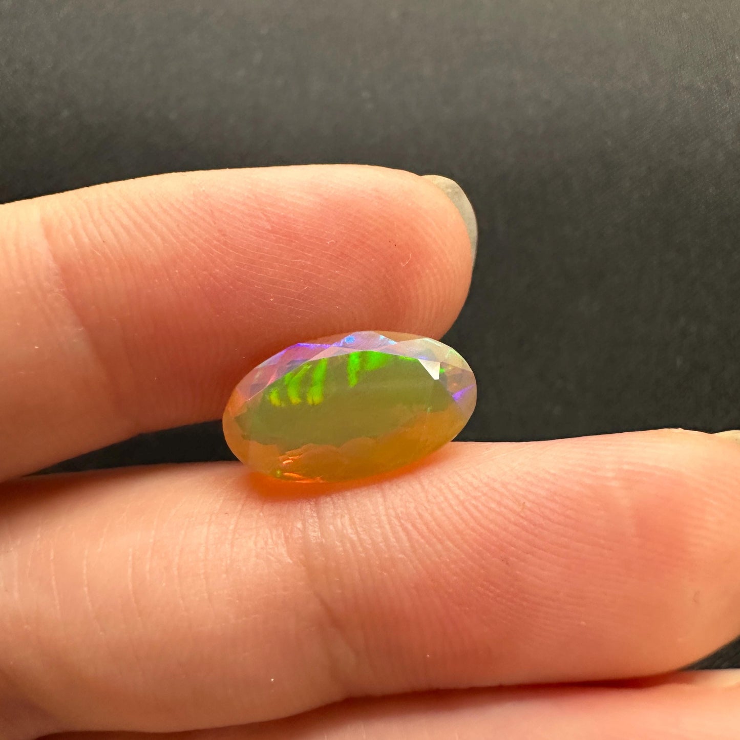3 Carat Ethiopian Opal 14.65x8.6mm Oval Cut, Faceted Loose Opal, Green Orange Yellow Blue Color Play