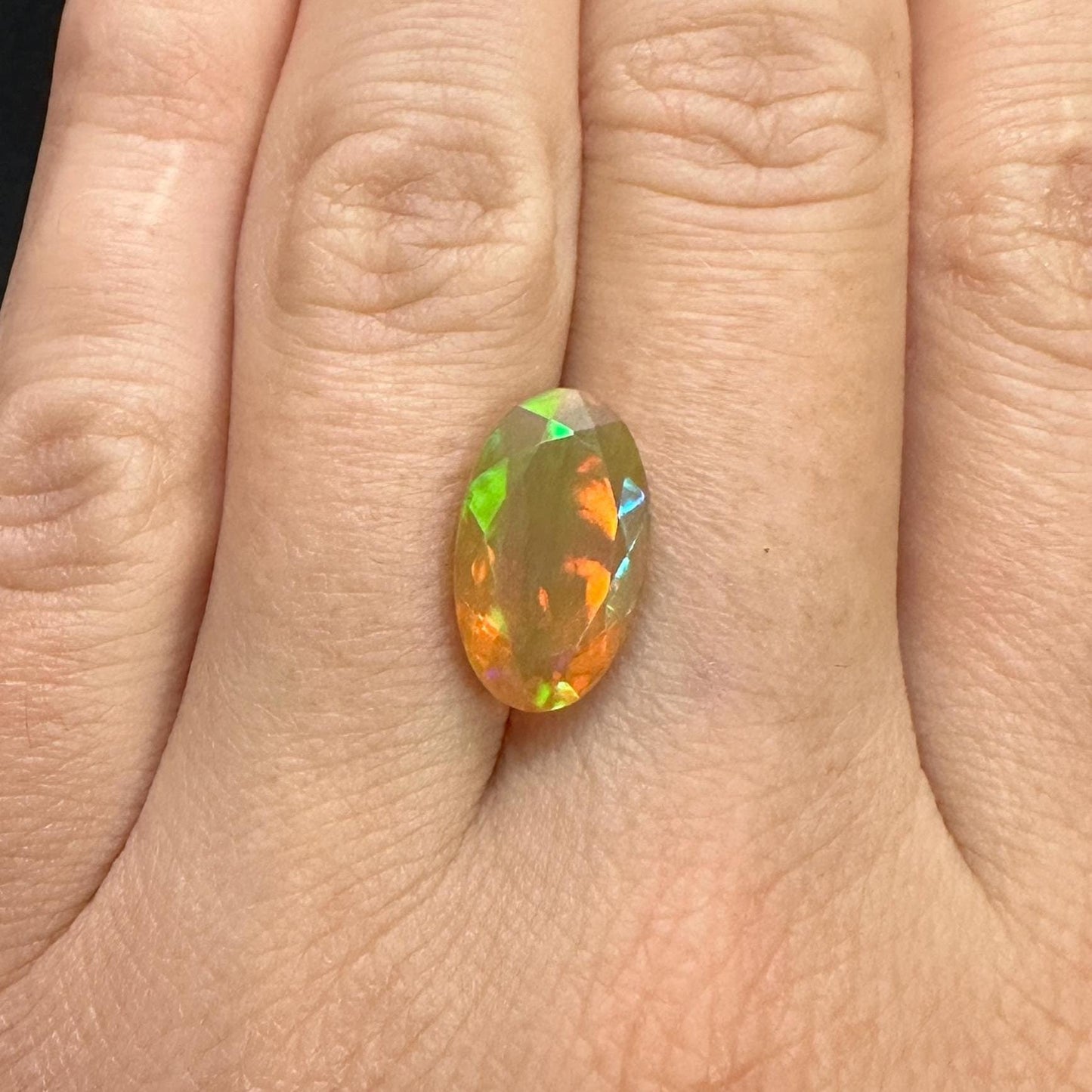 3 Carat Ethiopian Opal 14.65x8.6mm Oval Cut, Faceted Loose Opal, Green Orange Yellow Blue Color Play