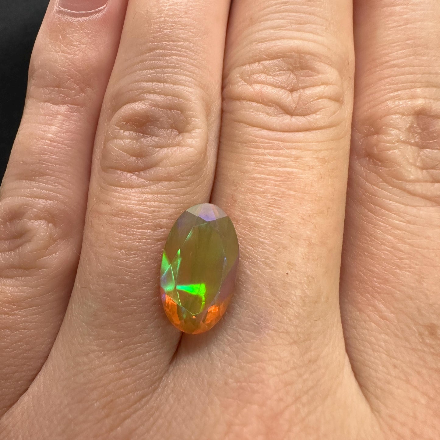 3 Carat Ethiopian Opal 14.65x8.6mm Oval Cut, Faceted Loose Opal, Green Orange Yellow Blue Color Play