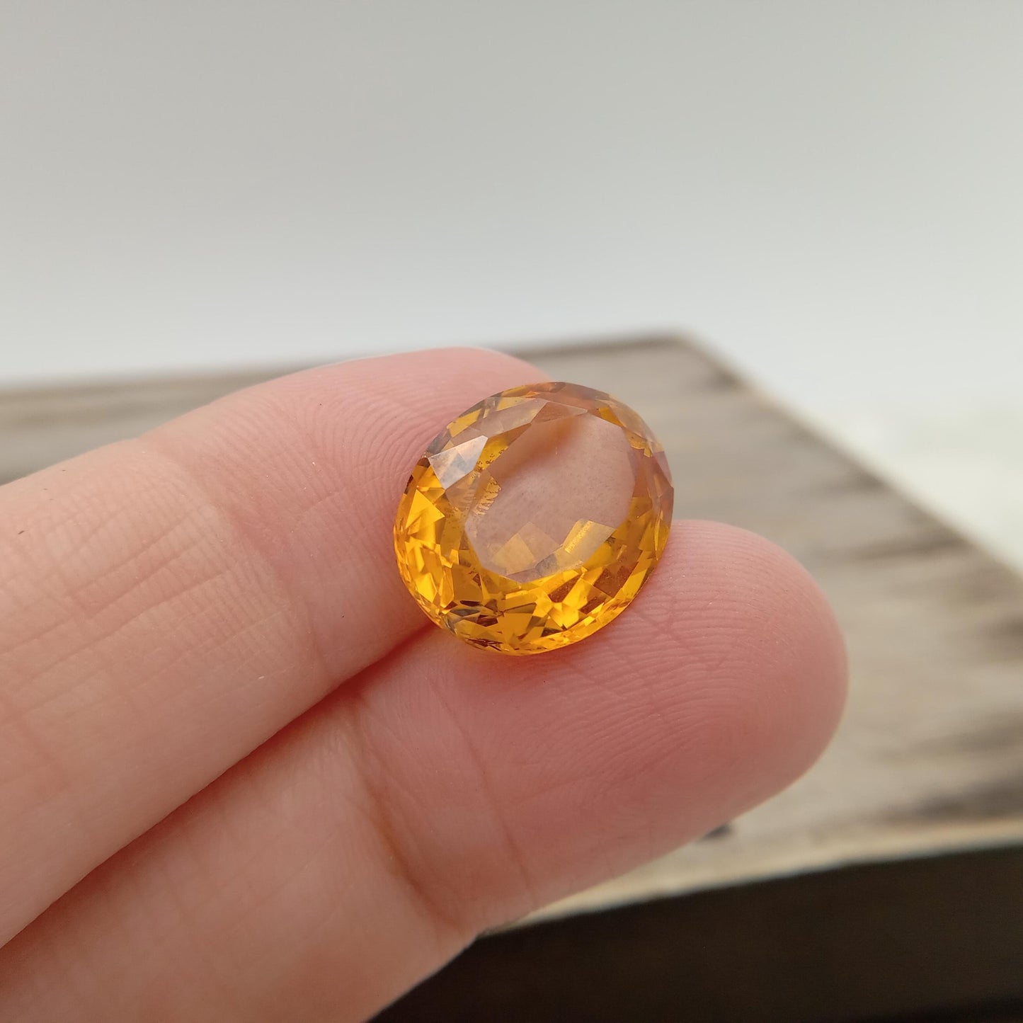 15.9mm x 12.2mm Oval Orange Yellow Synthetic Sapphire, 11.49 carat, Faceted Loose Gemstone