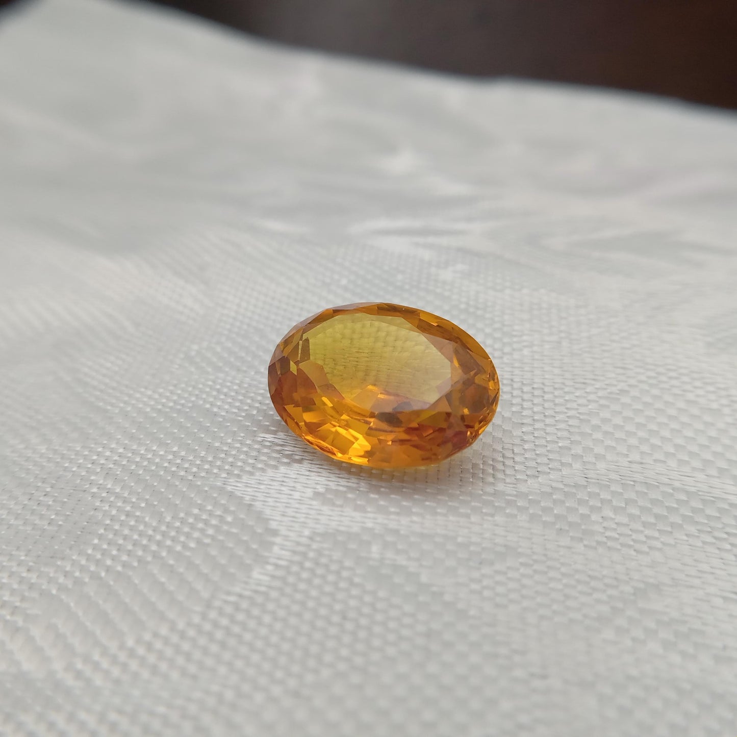 15.9mm x 12.2mm Oval Orange Yellow Synthetic Sapphire, 11.49 carat, Faceted Loose Gemstone