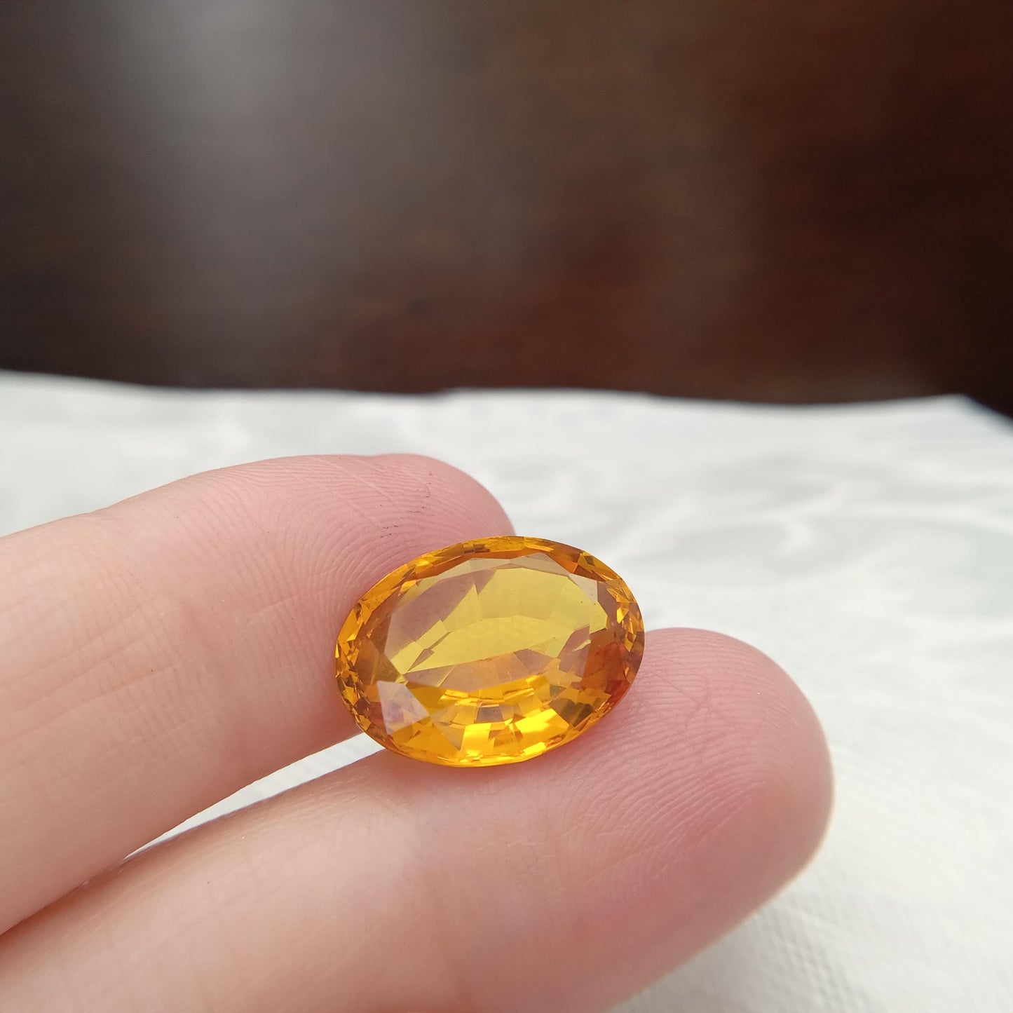 15.9mm x 12.2mm Oval Orange Yellow Synthetic Sapphire, 11.49 carat, Faceted Loose Gemstone