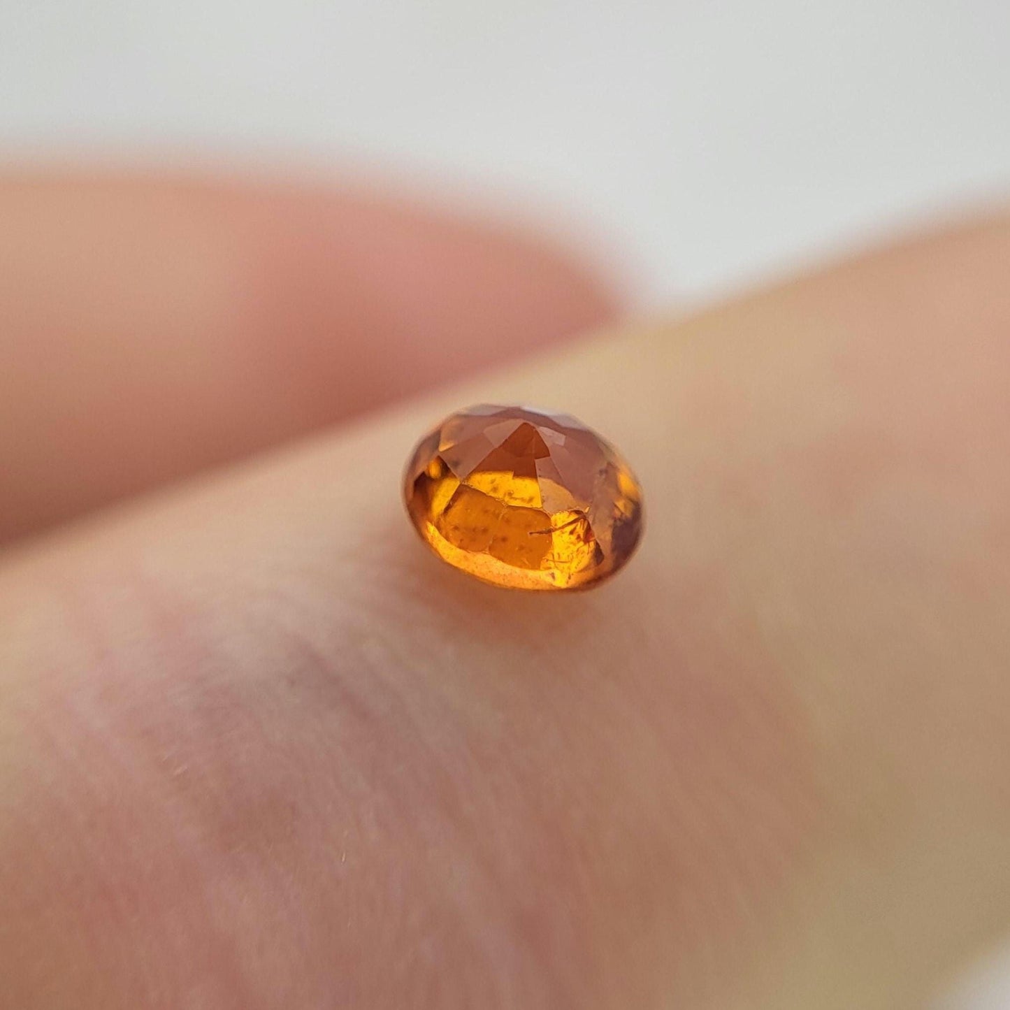 0.62 carat 5x4.3mm Natural Mandarin Spessartite Garnet, Faceted Oval Gemstone, Orange Garnet