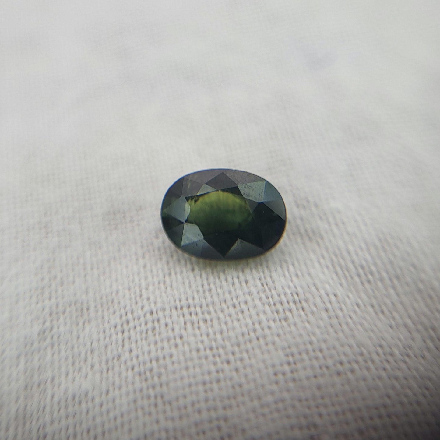 0.72 Carat Dark Green Sapphire 6.3x4.5mm Oval Cut, Faceted Loose Natural Heated Sapphire