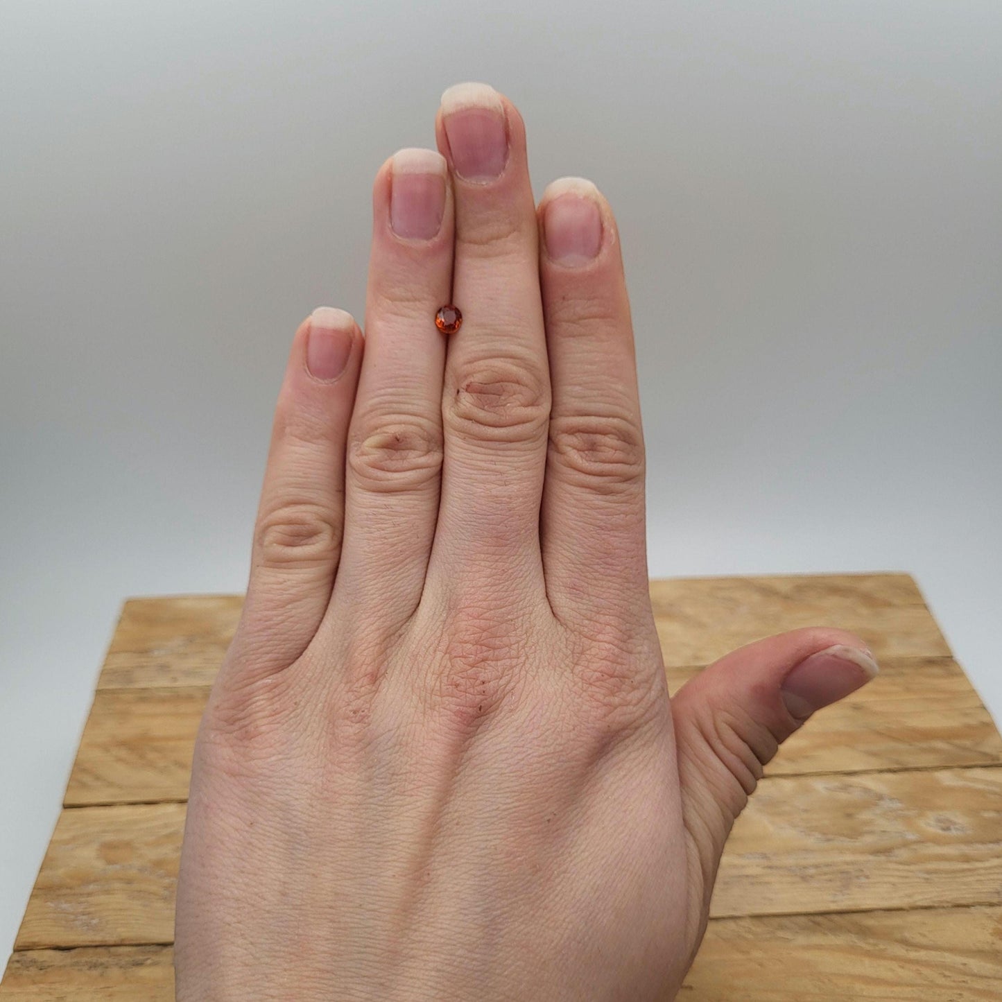 0.62 carat 5x4.3mm Natural Mandarin Spessartite Garnet, Faceted Oval Gemstone, Orange Garnet