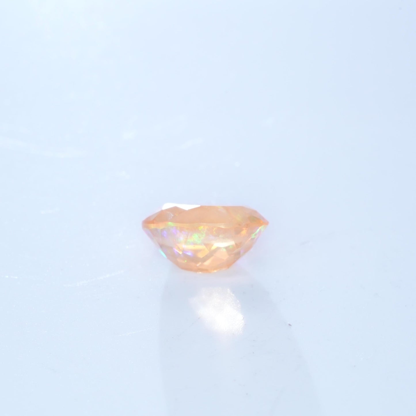 3.41 carat Orange Fire Opal with color play, 12.3x9.7mm Oval Cut