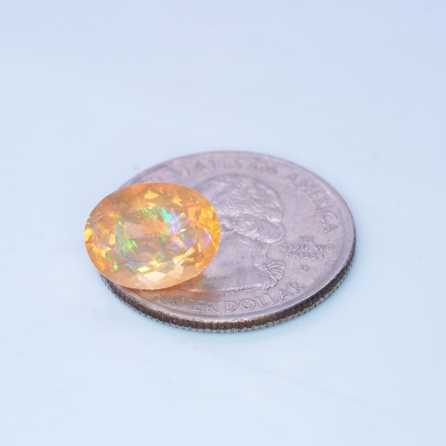 3.41 carat Orange Fire Opal with color play, 12.3x9.7mm Oval Cut