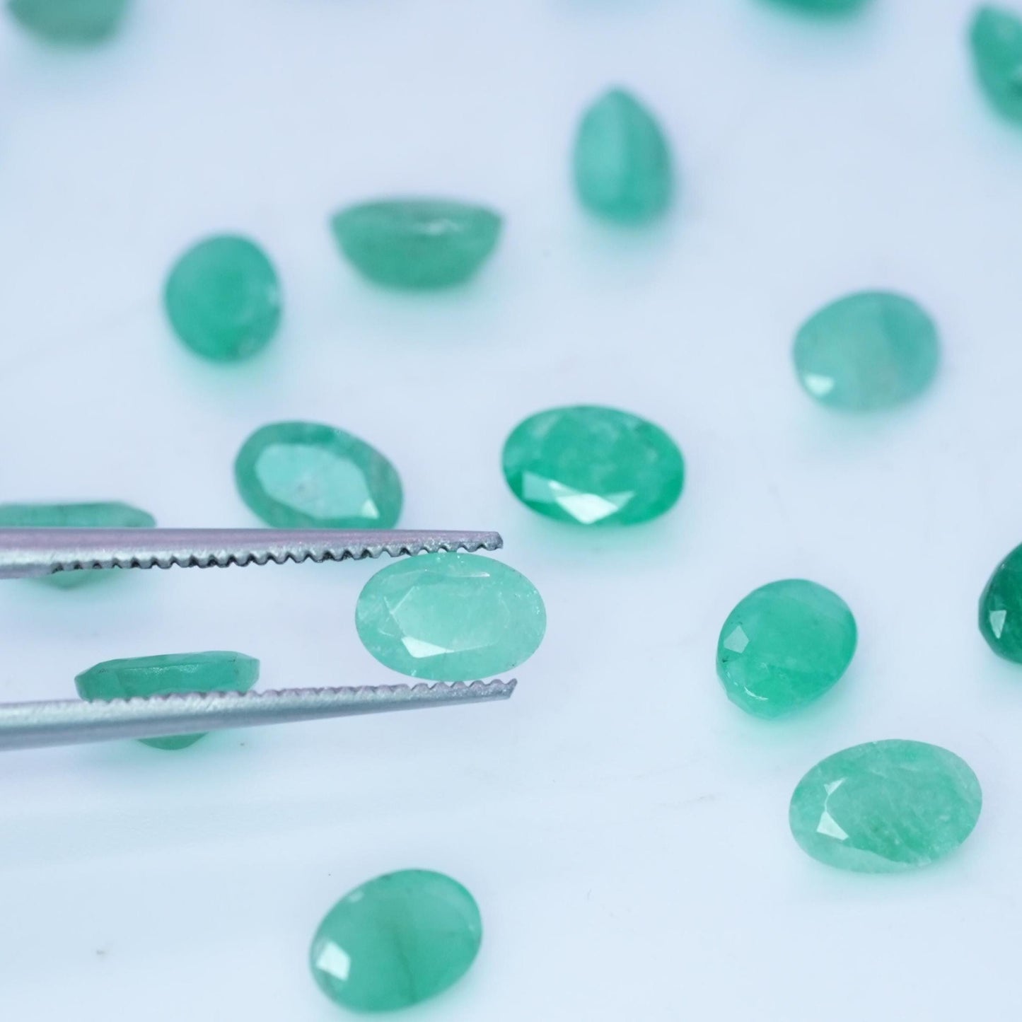 ONE- 6x4mm Cloudy Emerald Oval Cut